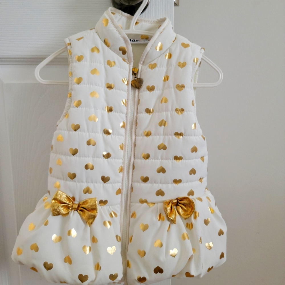 Puffer vests with two little bows in front. Size 24months.